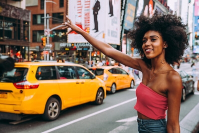 Lady hailing a cab in New York