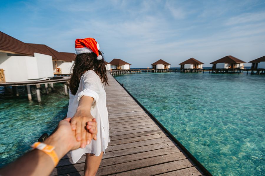 Lady with Santa hat on in the Maldives